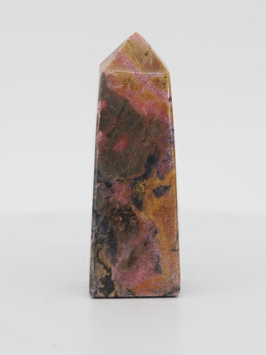 Polished Rhodonite tower from Pakistan featuring pink manganese, yellow spessartine, and black dendritic patterns.