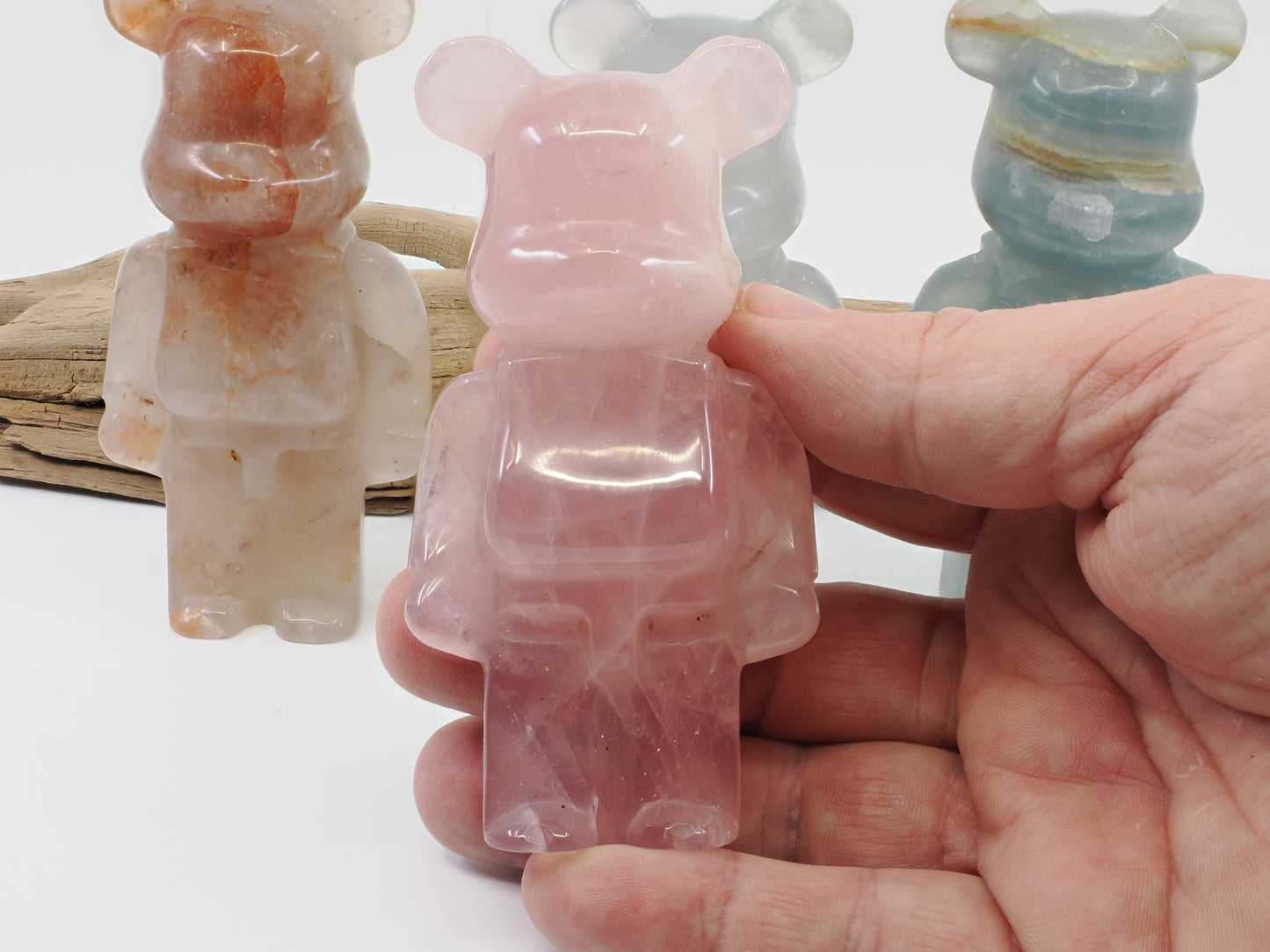 Handheld view of the Rose Quartz designer bear carving demonstrating the 3.8 inch scale and polished finish.