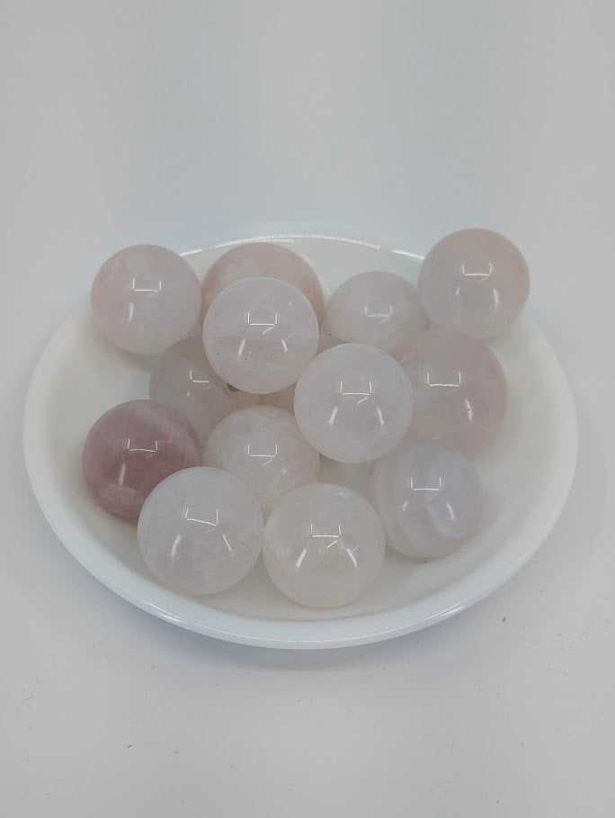 Rose Quartz mini spheres in white bowl, Brazil