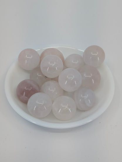 Rose Quartz mini spheres in white bowl, Brazil