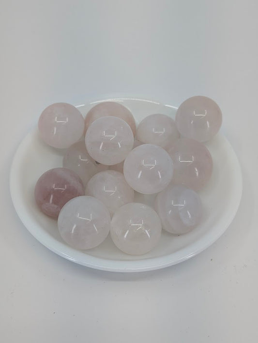 Rose Quartz mini spheres in white bowl, Brazil