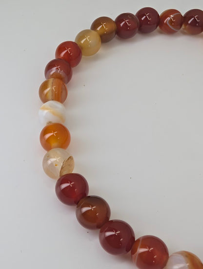 Detailed view of Sardonyx beads showing translucent layers