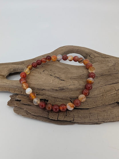 6 mm Sardonyx bracelet showing red, orange, and cream banding
