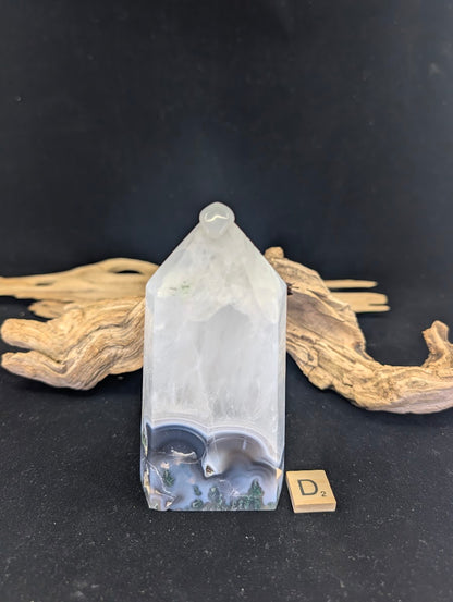 Side angle of Variant D highlighting the dual druzy vug openings.