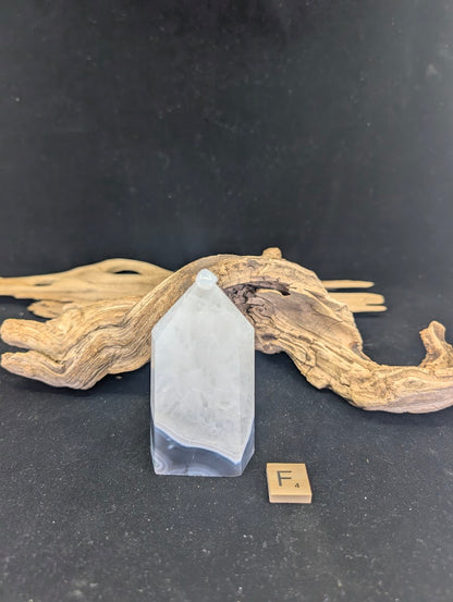 Front view of Variant F (240g/9.5cm) with scenic inclusions and druzy base