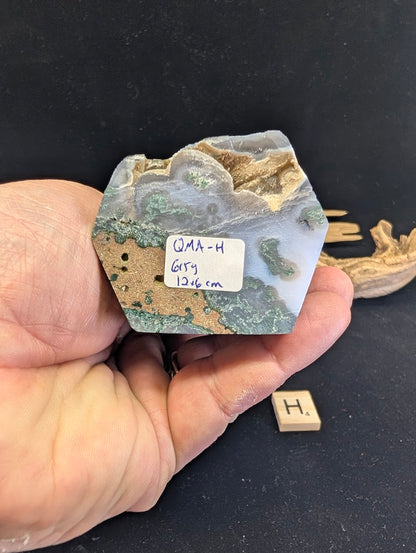 Base view of Variant H confirming 615g weight and 12x6cm dimensions.