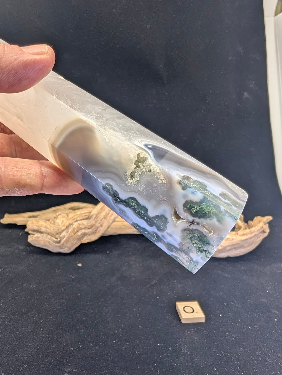 Macro detail of the scenic landscape transition in Variant O tower.