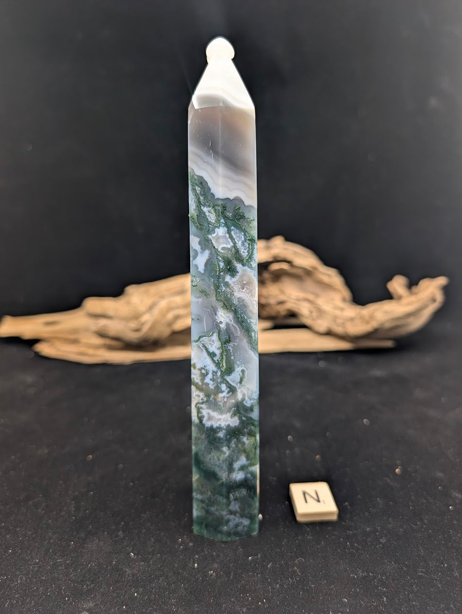 Side view of Variant N Moss Agate tower with high-contrast snow-capped fortification banding.