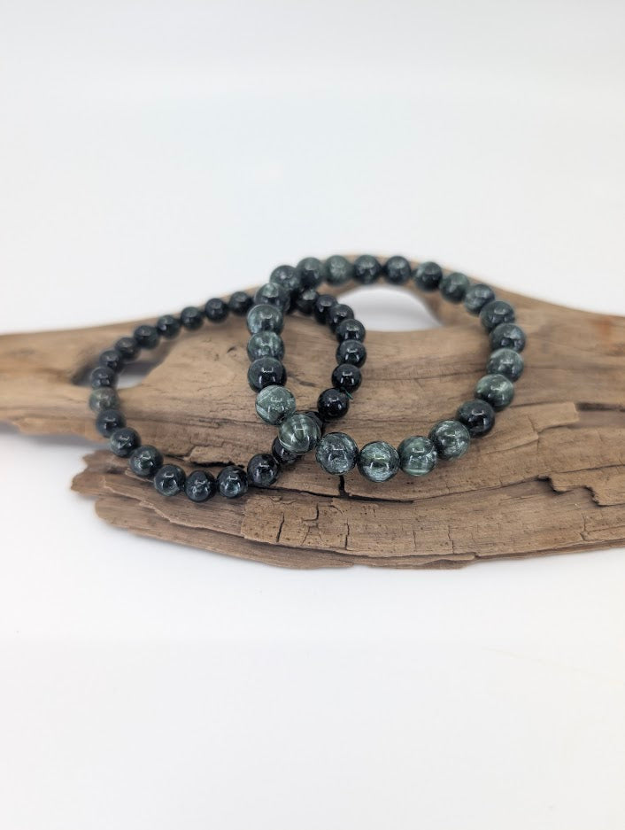 Seraphinite bracelets in 6 mm and 8 mm showing silver feather pattern