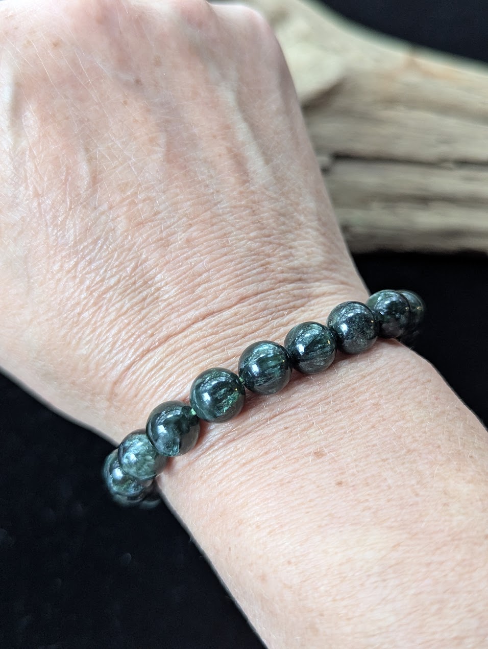 9mm Seraphinite (Clinochlore) Bracelet shown worn on a wrist.