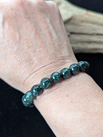9mm Seraphinite (Clinochlore) Bracelet shown worn on a wrist.