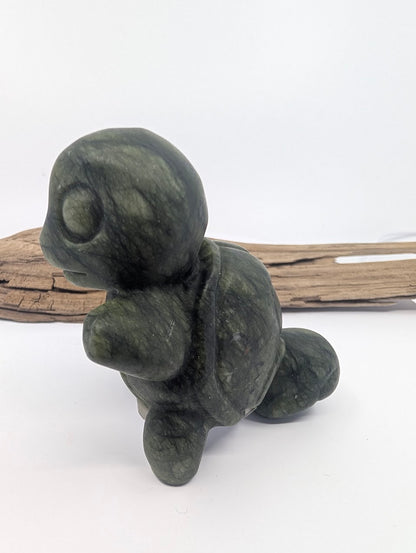 Side profile of hand-carved Serpentine Squirtle showing the natural shell-like patterns in the stone.