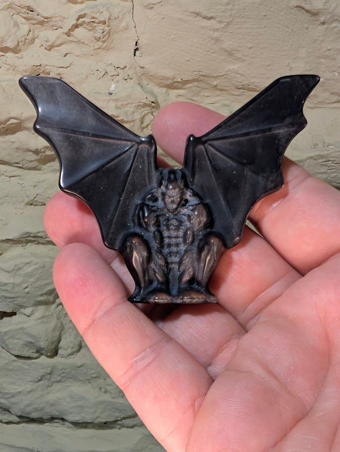 Silver obsidian gargoyle carving – front view in hand showing size and detail