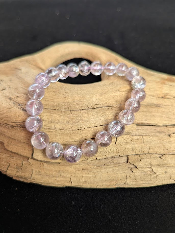 9mm AA Grade Smoky Amethyst beaded stretch bracelet worn on a wrist for scale demonstration.