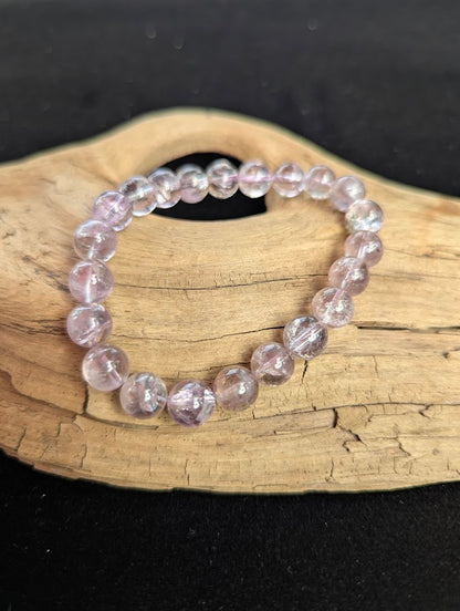9mm AA Grade Smoky Amethyst beaded stretch bracelet worn on a wrist for scale demonstration.