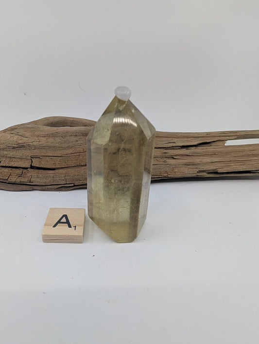 Polished Smoky Citrine tower Piece A from Brazil, 62mm tall, in a standing display.