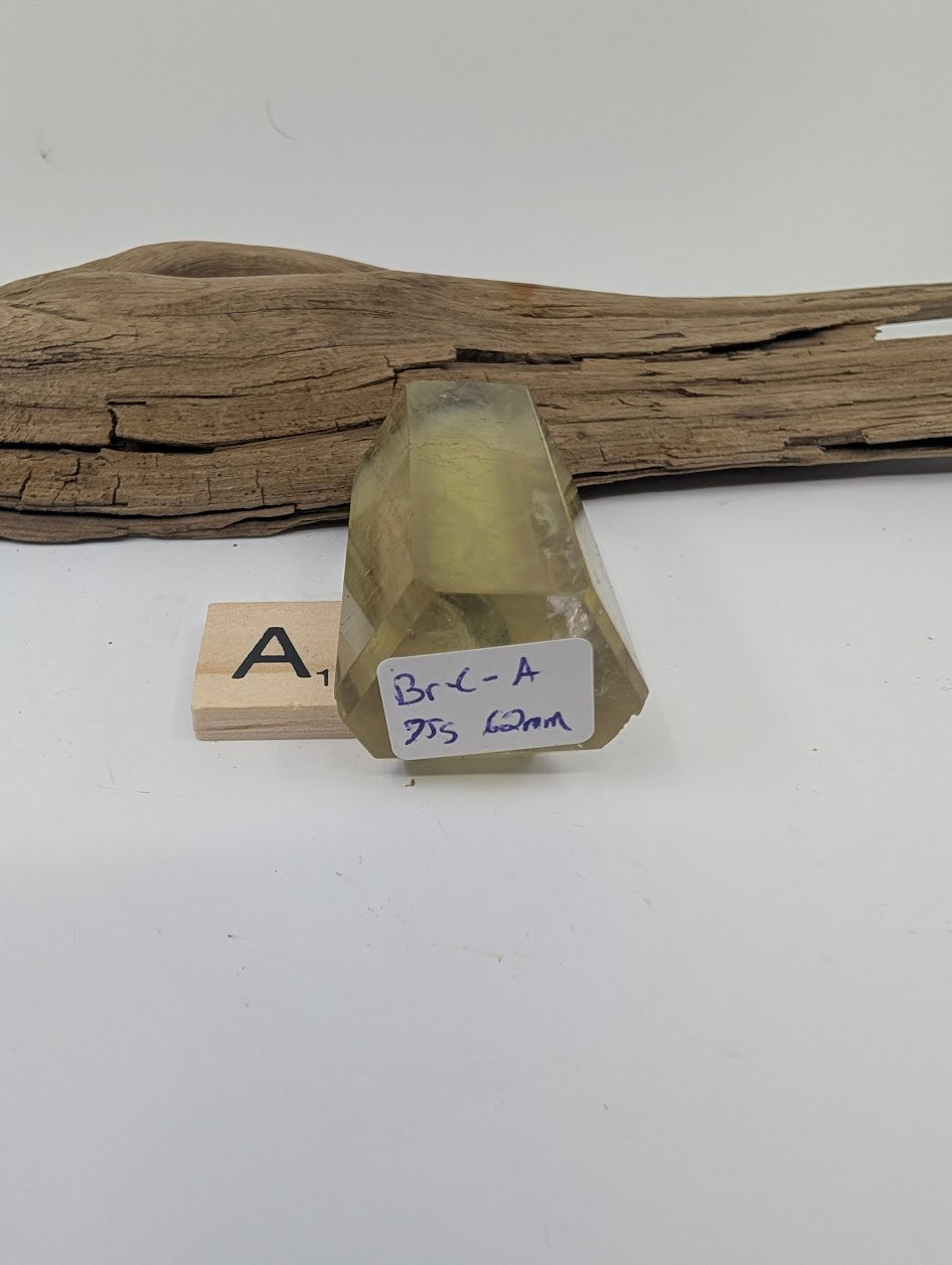 Polished Smoky Citrine tower Piece A from Brazil showing its 75g and 62mm measurement label.