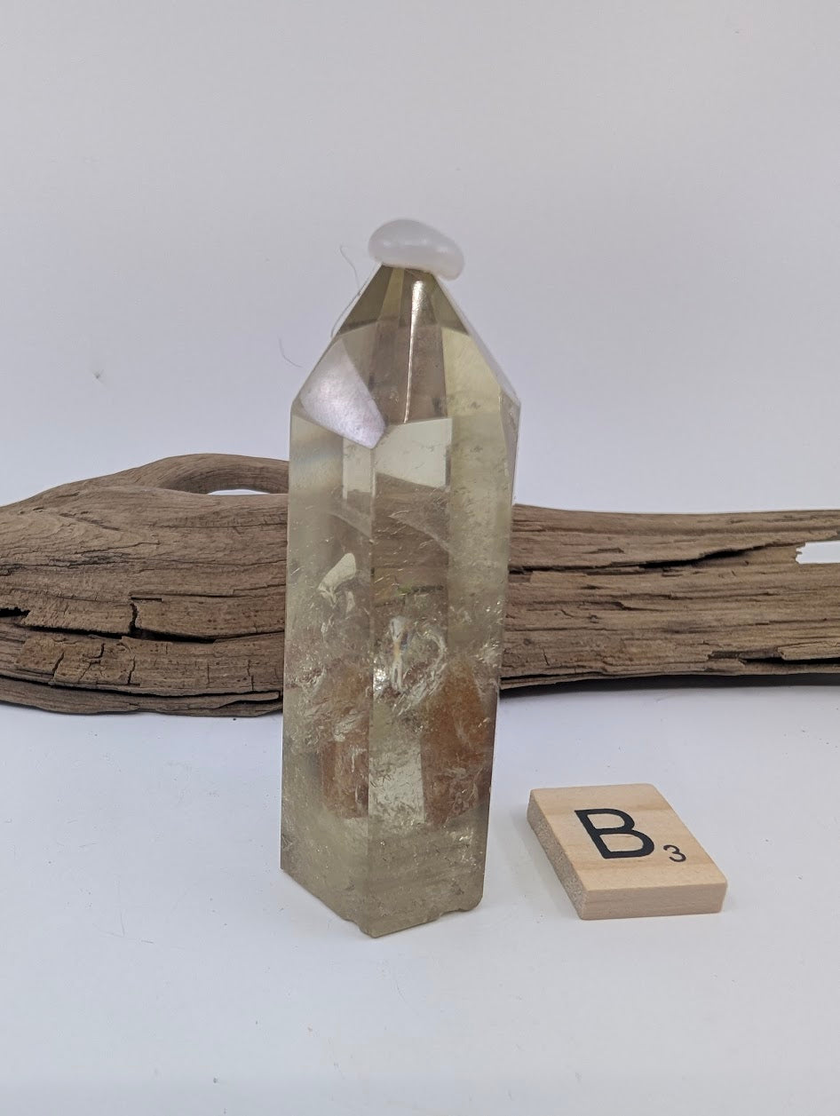 Polished Smoky Citrine tower Piece B from Brazil, 78mm tall, in a standing display.