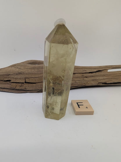 Polished Smoky Citrine tower Piece F from Brazil, 84mm tall, in a standing display.