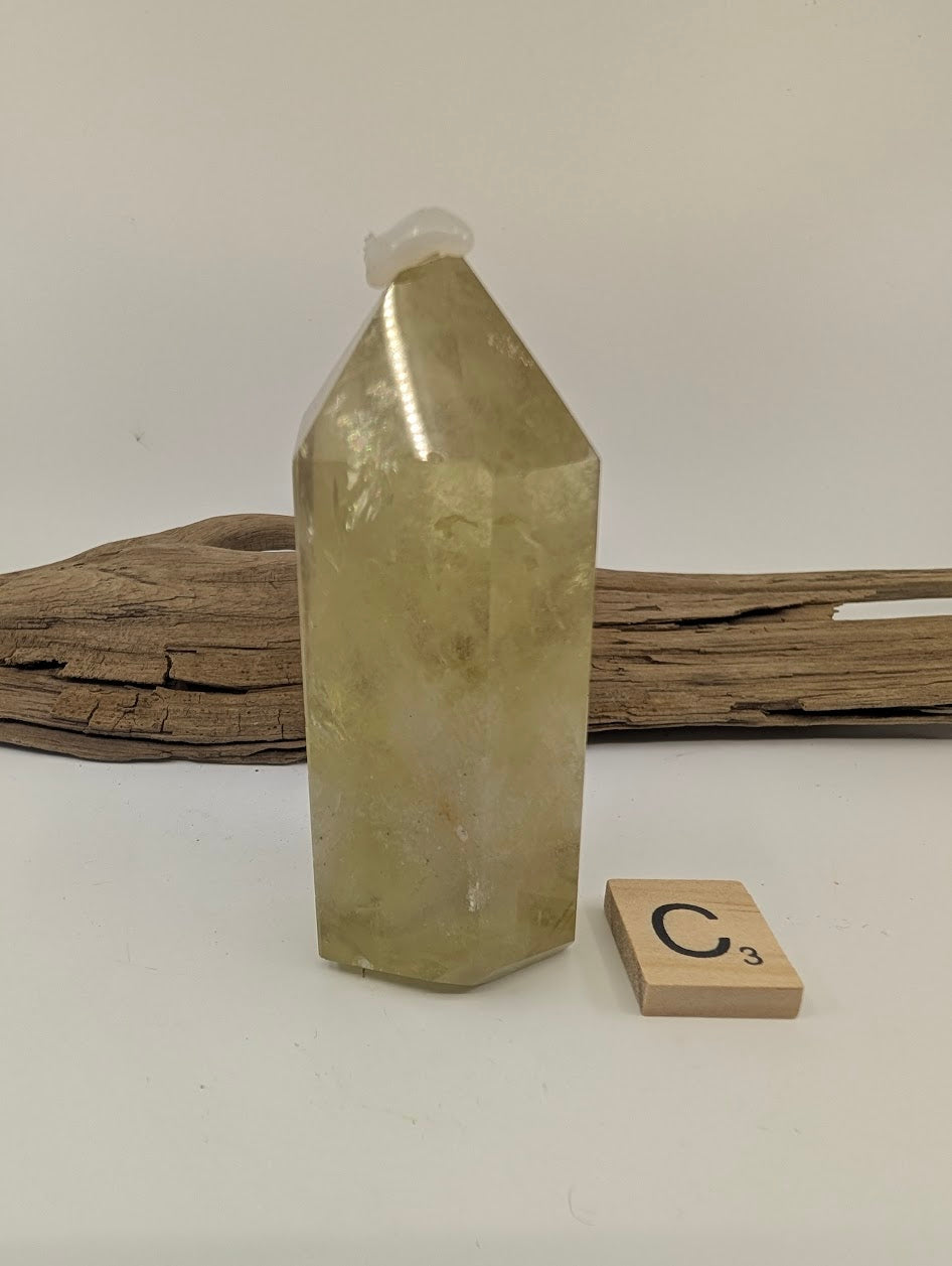 Polished Smoky Citrine tower Piece C from Brazil, 85mm tall, in a standing display.