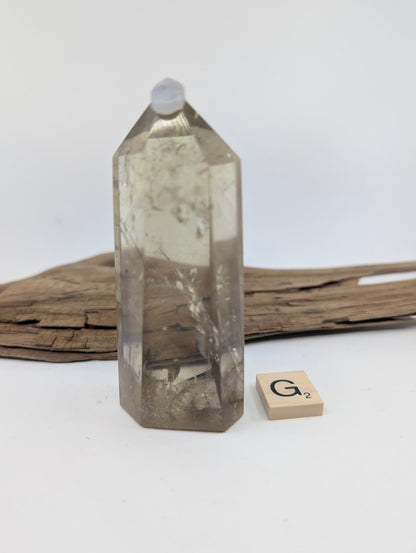 Polished Smoky Citrine tower Piece G from Brazil, approximately 90mm tall, in a standing display.