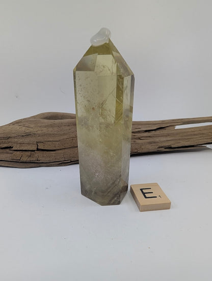 Polished Smoky Citrine tower Piece E from Brazil, 92mm tall, in a standing display.