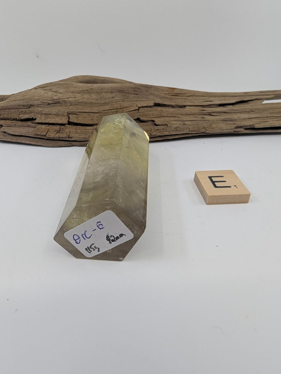 Polished Smoky Citrine tower Piece E from Brazil showing its 115g and 92mm measurement label.
