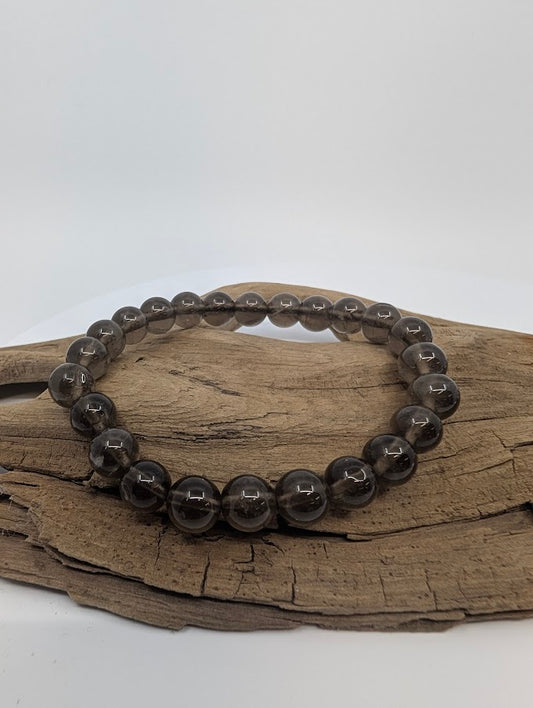 8MM Smoky Quartz bracelet displayed on wood background