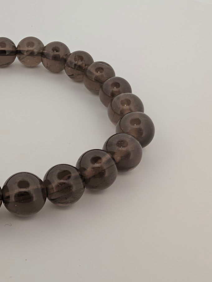 8MM Smoky Quartz bracelet beads showing natural clarity and smoky tones