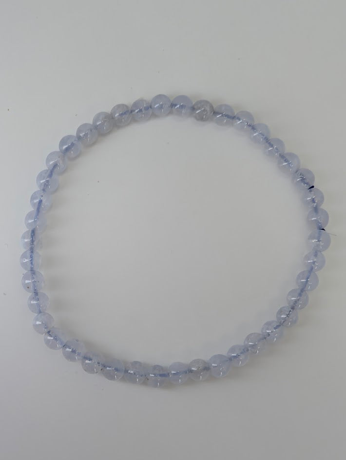 Detailed view of 4.5 mm Snowflake Blue Lace Agate beads showing natural pattern