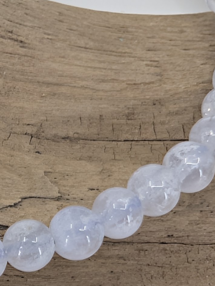 Round polished Blue Lace Agate bracelet with snowflake texture