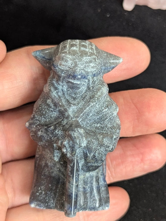 Front view of a blue Sodalite Yoda carving showing deep cobalt tones and white speckled inclusions.