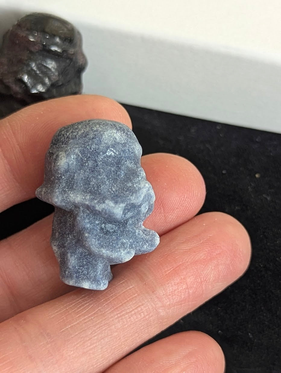 Angled view of a Blue Aventurine Storm Trooper showing precision-carved helmet details.