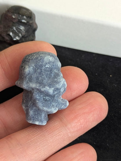 Angled view of a Blue Aventurine Storm Trooper showing precision-carved helmet details.