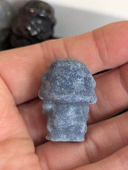 Rear view of a hand-held Blue Aventurine Storm Trooper carving.