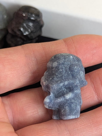 Rear view of a hand-held Blue Aventurine Storm Trooper carving.