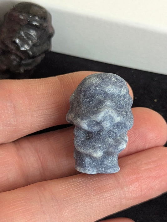 Front view of a 3cm Storm Trooper carved from natural Blue Aventurine.