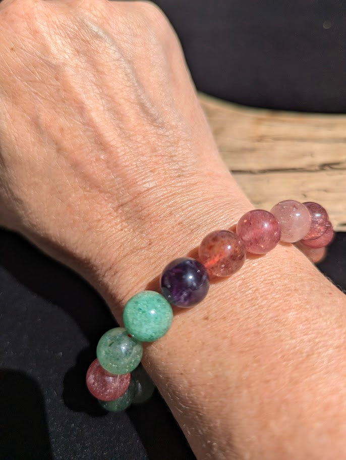11mm Super 8 mixed mineral beaded stretch bracelet worn on a wrist for size scale.