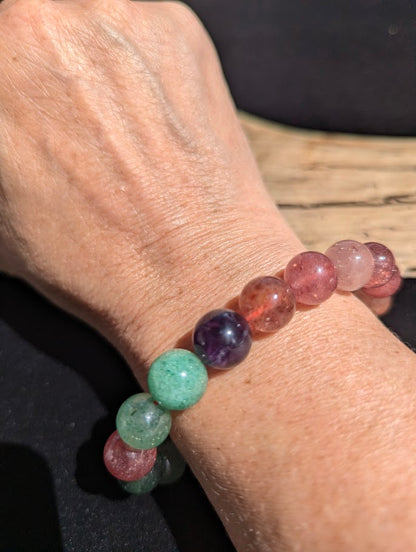 11mm Super 8 mixed mineral beaded stretch bracelet worn on a wrist for size scale.