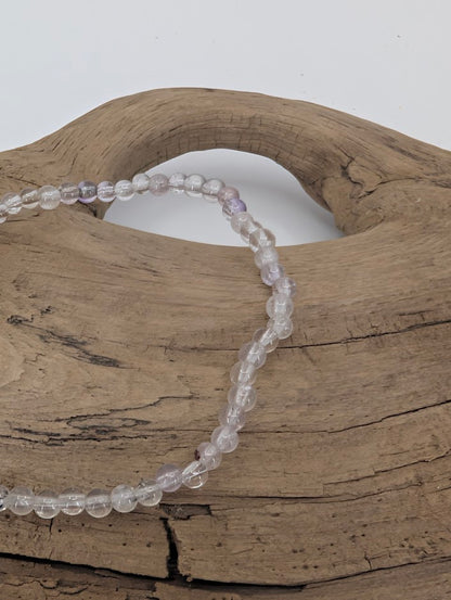 Close-up of Super Seven beads showing fine inclusions