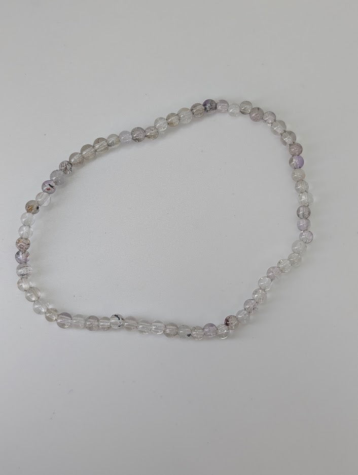 Natural Super Seven bracelet with clear quartz and amethyst tones