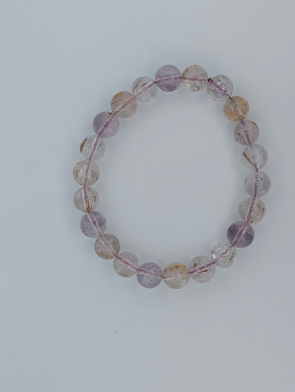 8MM Super Seven bracelet featuring natural polished round beads