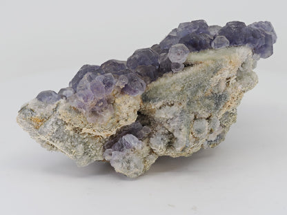 Profile angle of a Chinese Fluorite specimen showing the self-supporting matrix structure.