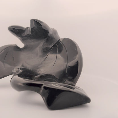 Rear view of Black Obsidian Toothless carving, polished tail and wings