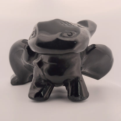 Black Obsidian Toothless dragon carving, front view with glossy polish