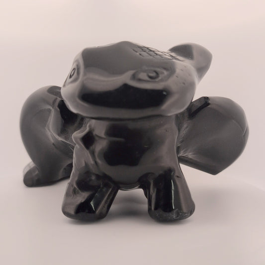 Black Obsidian Toothless dragon carving, front view with glossy polish