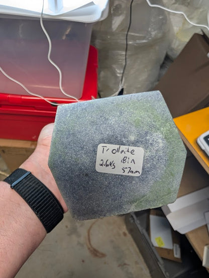 Base view of Trollite tower labeled TR-02, showing natural texture and hexagonal shaping