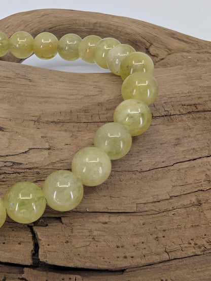 Close-up of natural 7mm Tsavorite Garnet bracelet highlighting clarity and color