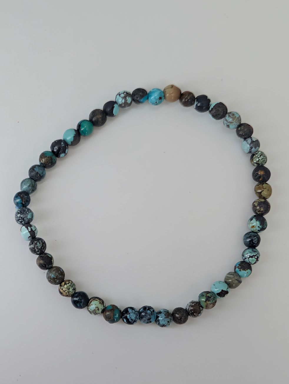 Natural turquoise gemstone bracelet on stretch cord with mixed hues