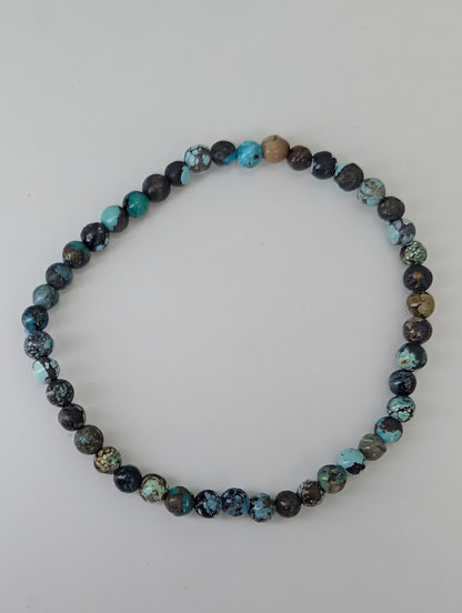 Natural turquoise gemstone bracelet on stretch cord with mixed hues